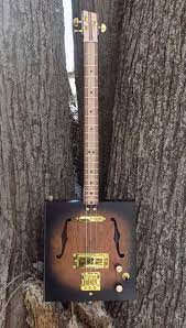 Learn How To Play Cigar Box Guitar Kalymi Music Blogs