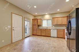Maybe you would like to learn more about one of these? Light And Airy Kitchen Room With Freshly Painted Walls In Beige Color Light Wood Cabinets And Black Refrigerator Atop Tile Floor Northwest Usa Stock Photo Picture And Royalty Free Image Image 72105380