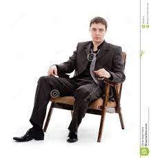 A Young Man In A Suit And Tie Sitting In A Chair Stock Image Image Of Brunette Clerk 19548159 Suit And Tie Young Man Man