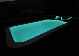 A Glow In The Dark Pool By Atmosphere Piscines Pool At Night Glow In The Dark Cool Pools