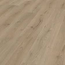 When you're comparing laminated timber and engineered hardwood flooring you'll find that there are certain areas where they outshine each other. Hanwood Home 7mm 2 872sqm Mink Oak Laminate Flooring Bunnings Australia