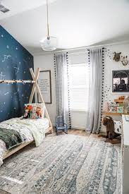 Blue accent wall in my children's room we recently livened up the small room (approximately 10 x 12 feet) that our kids share by painting one of the walls a warm blue color. Check Out This Boy S Adventure Bedroom American Farmhouse Lifestyle