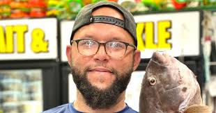 Bill Erdman catches 1st striper in contest named for his dad