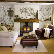 A beachy living room with a gorgeous artwork, light blue chairs, a cork table and a rug. 15 Relaxing Brown And Tan Living Room Designs Home Design Lover