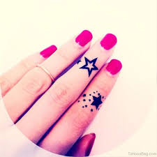 A pair of black designs are depicted on the wearers' ring fingers in this tattoo set that replaces traditional wedding rings. 23 Best Star Tattoos For Fingers