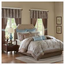 The blue euro shams feature brown flanges that add a charming touch and two embroidered decorative pillows provide a lavish accent. Blue Brown Bedding Target