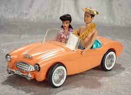 Ponytail Barbie And Ken In Original Hawaiian Costumes In Her Original Austin Healey September 26 Vintage Barbie Clothes Barbie And Ken Vintage Barbie Dolls