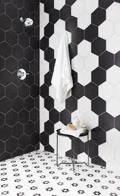 But on this bathroom wall, the white marble tiles have gray veins and black grouting. Cool And Unexpected Tile Combinations For The Kitchen And Bath White Tile Floor White Bathroom Tiles Black And White Tiles