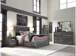 Update your bedroom with this sleek panel bed with a storage footboard with two drawers and two under bed storage drawers on each side of the bed. Ashley Baystorm 7 Piece King Storage Bedroom Set B221 31 36 58 56s 60 2 B100 14 Portland Or