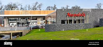 Retail Business Nando S Casual Dining Restaurant In The Elliotts Field Shopping Centre With Next Retail Clothing Shop Front At Rugby Warwickshire Uk Stock Photo Alamy