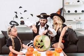 Find furniture & decor you love at hayneedle, where you can buy online while you explore our room designs and curated looks for tips, ideas & inspiration to help you along the way. Family In Halloween Costumes On Sofa At Coffee Table With Pumpkins At Home Free Stock Photo And Image