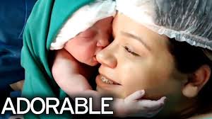 Emotional Moment Newborn Clings To Mother's Face