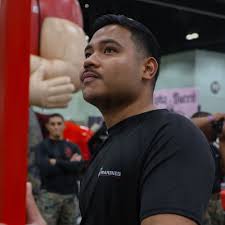 U.S. Marine Corps Capt. Luke Dalton, a KC-130J Super Hercules pilot with  Marine Aerial Refueler Transport Squadron (VMGR) 152, checks the  communications