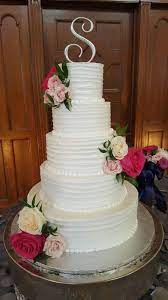 White Cake With Letter S On Top Cakes In Houston Tx Cake Wedding Cake Inspiration Custom Wedding Cakes