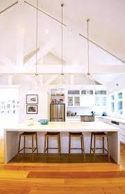 Fluorescent lights are energy efficient lighting choices. Sloped Ceiling Lighting Ideas Vaulted Ceiling Kitchen Coastal Kitchen Design Kitchen Inspiration Design
