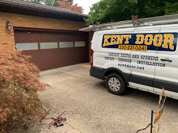 Garage door torsion & extension springs, ez set springs, and torquemaster springs; New Garage Door Installation Old Garage Door Replacement New Doors