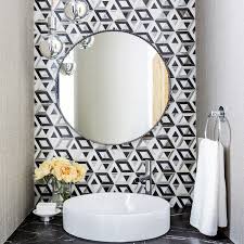 Give a dated bathroom mirror a fresh new look by wrapping it in a crisp, white frame. 19 Best Bathroom Mirror Ideas