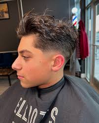 Elliot's Barbershop added a new...