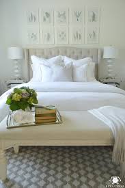 This beautiful, blue bedroom uses ocean blue bedding, a tufted and upholstered azure headboard, an elegantly blue painted tray ceiling, and blue draperies to really drive its point home. Guest Bedroom Reveal The White Room