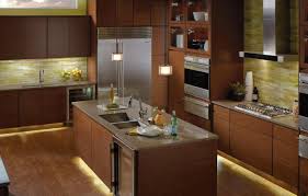 A good general rule is to center a light fixture under each set of cabinets doors in your kitchen. Recessed Lighting Keeping Your Kitchen Bright Reno Quotes