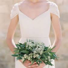Modern orange, white & green bouquet with fun textures orange, yellow, green, ranunculus, roses, berries, round shape. 16 Pretty Greenery Bridal Bouquets