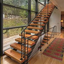 It features black metal railing, wood stair treads and creates a seamless, stylish transition between the upper and lower levels of this home. Factory Sell Steel Wood Stair Price Moderm Space Saving Straight Staircase Design Pr L45