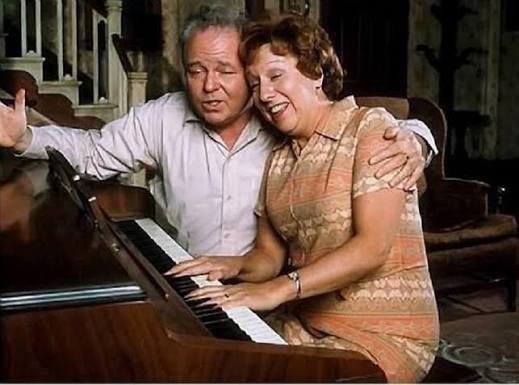 ALL IN THE FAMILY — Archie (Carroll O'Connor) and Edith (Jean Stapleton)  gathered around the piano, sharing one of those rare, tender moments that  showed the heart beneath the arguments. Scenes like