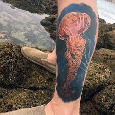 100 Jellyfish Tattoo Designs For Men Free Swimming Marine Ideas Jellyfish Tattoo Jellyfish Tattoo Design Tattoo Designs Men