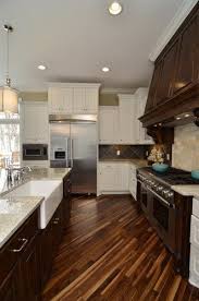 Dark wood kitchen islands are a great way to add a useful surface and storage medium if you have 5. Floor It S Where The Heart Is Home Kitchen Design Modern Traditional Kitchen