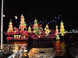A beautiful deck/dock and boat slip along lake austin using gray composite decking by timbertech. Classic Casual Home Christmas On The Dock Of The Bay Boat Parade Outdoor Christmas Christmas Lights