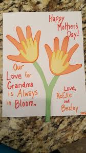The kids will have so much fun making these handprint flowers. Handprint Flowers For Mother S Day Our Love For Grandma Is Always In Bloom Grandma Crafts Happy Mothers Day Mothers Day Flowers