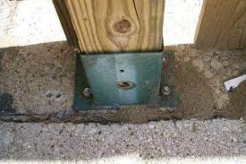 We had to cut off the old wrought iron handrails and cover the old concrete with blue stone. How To Attach A Wooden Railing To A Concrete Porch Hunker Concrete Front Porch Concrete Porch Porch Handrails