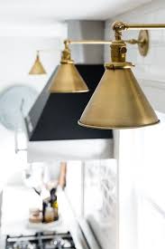 Sconces not only add illumination to your kitchen but can also shine a spotlight on specific areas, like faucets, sinks or counters. How To Add Character To Your Home Allisa Jacobs Kitchen Wall Lights Brass Wall Light Sconce Kitchen