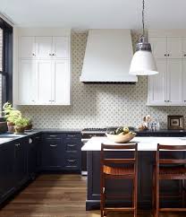 Black And White Kitchen With Wood Floors White Upper Cabinets Dark Lower Cabinets Industrial Pe Wood Floor Kitchen New Kitchen Cabinets Kitchen Inspirations