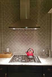 A beadboard backsplash is easy to install and instantly brightens your kitchen. Amazing Herringbone Patterned Backsplash Using Smoke Glass Subway Tile Gorgeous Https Herringbone Backsplash Beadboard Backsplash Kitchen Tiles Backsplash