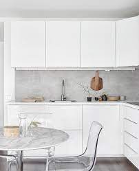 To go contemporary, pair your white cabinets with black hardware. Findlay Residence By Splyce Design A Modern House With A Simple Interior Palette Modern Kitchen Interiors Kitchen Interior Concrete Kitchen
