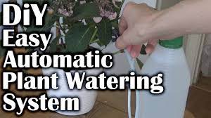 Very Easy To Make Automatic Plant Watering System Perfect For Vacation Time Handmade Crafts Howto Diy Plant Watering System Diy Plants