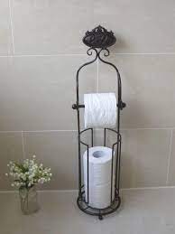 The 1891 patent showed illustrations that the paper goes up and over the roll. Antique French Vintage Style Black Free Standing Toilet Roll Holder With Storag Toilet Roll Holder Toilet Roll Holder Storage Free Standing Toilet Paper Holder