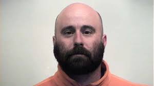 Police: Man hits neighbor with stick during argument over dog