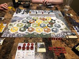 The game is rated for between three and four players aged 14 and up, and will. The Review Corner Catan Brotherhood Of The Watch Review Miniature Market