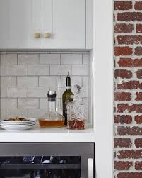 Light Grey Cabinetry Natural Red Brick Walls White Subway Tile Beverage Fridge Orsi Panos Interiors Light Grey Kitchens Grey Kitchen Red Brick Walls