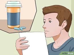 Kneel on floor with cat wedged firmly between knees, hold front and rear paws. 6 Ways To Give A Cat A Pill Wikihow Pet