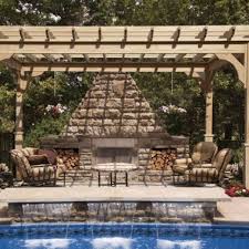 a fire pit under a canopy in an open field