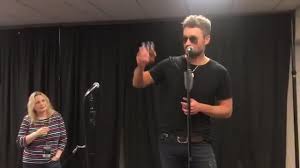 eric church toasts after receiving riaa plaque