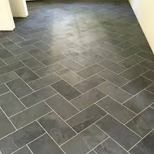 A Light Grout Color Here Really Helps That Herringbone Pattern Stand Out Tile Floor Best Bathroom Flooring Floor Tile Grout