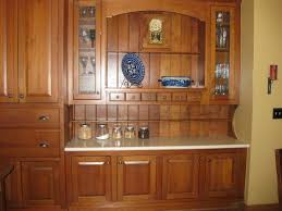 Stock base cabinets (we used two 30 base cabinet from lowe's) thin plywood to finish the cabinet ends countertop (we used 2x12 boards) Built In Kitchen Cabinet Makeover