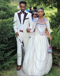 Forafricans An Oromo Bride And Groom In Contemporary Ethiopian Wedding Attire Addis Ababa E With Images Ethiopian Traditional Dress Ethiopian Dress Traditional Outfits