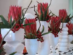 Christmas Table With Proteas African Christmas Christmas Arrangements Christmas Decorations Table Settings