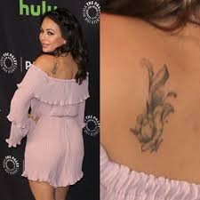 Because of the wide and flat surface many different tattoo themes work really well on this area. Janel Parrish Flower Shoulder Blade Tattoo Steal Her Style