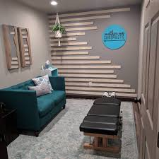 Mother Me Chiropractic Adjusting Room Chiropractic Office Design Chiropractic Office Decor Waiting Room Design